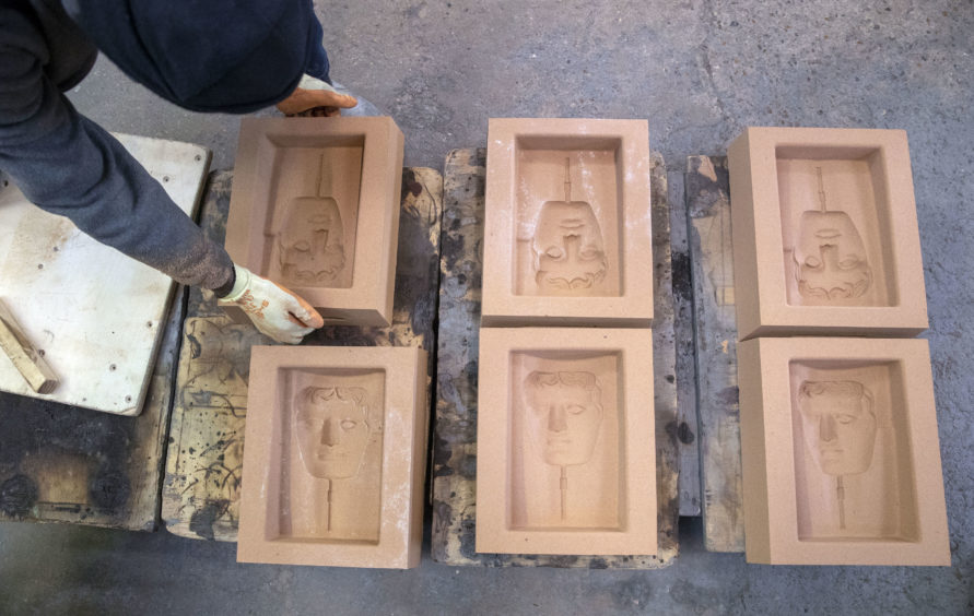 Sand casts are prepared during the hand-made casting of the British Academy of Film and Television Awards (BAFTA) masks.