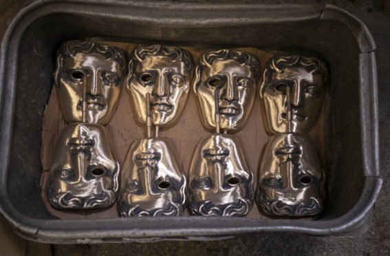Finished masks wait to be collected during the hand-made casting of the British Academy of Film and Television Awards (BAFTA) masks.