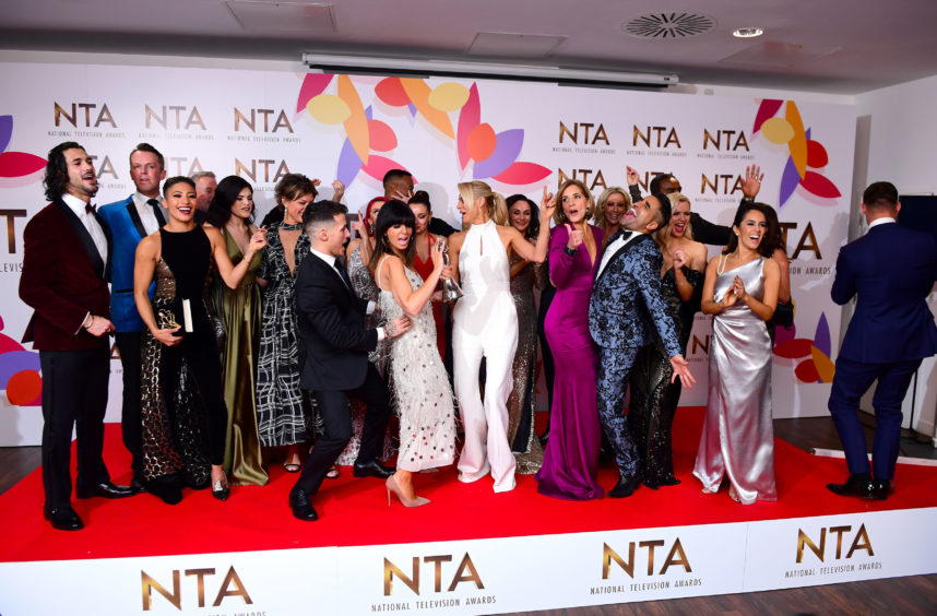 Claudia Winkleman and Tess Daly with the stars of Strictly Come Dancing which was crowned winner of the Best Talent Show category.