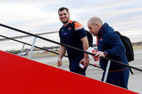 Edinburgh's head coach Richard Cockerill and Stuart McInally board the plane to travel to Toulon.