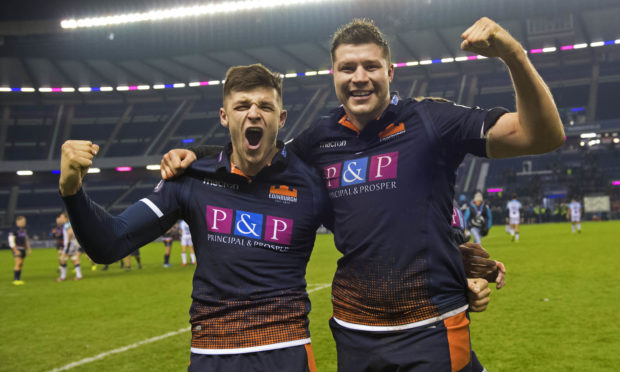 Edinburgh's Blair Kinghorn (L) and Grant Gilchrist celebrate at full-time.