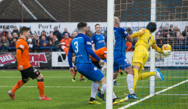 Dundee United's Pavol Safranko heads in from close range to open the scoring