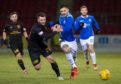 Livi's Craig Halkett battles with Tony Watt of St Johnstone.