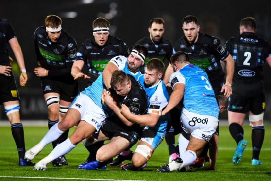 Warriors centre Stafford McDowall is tackled by Scott Baldwin at Scotstoun.