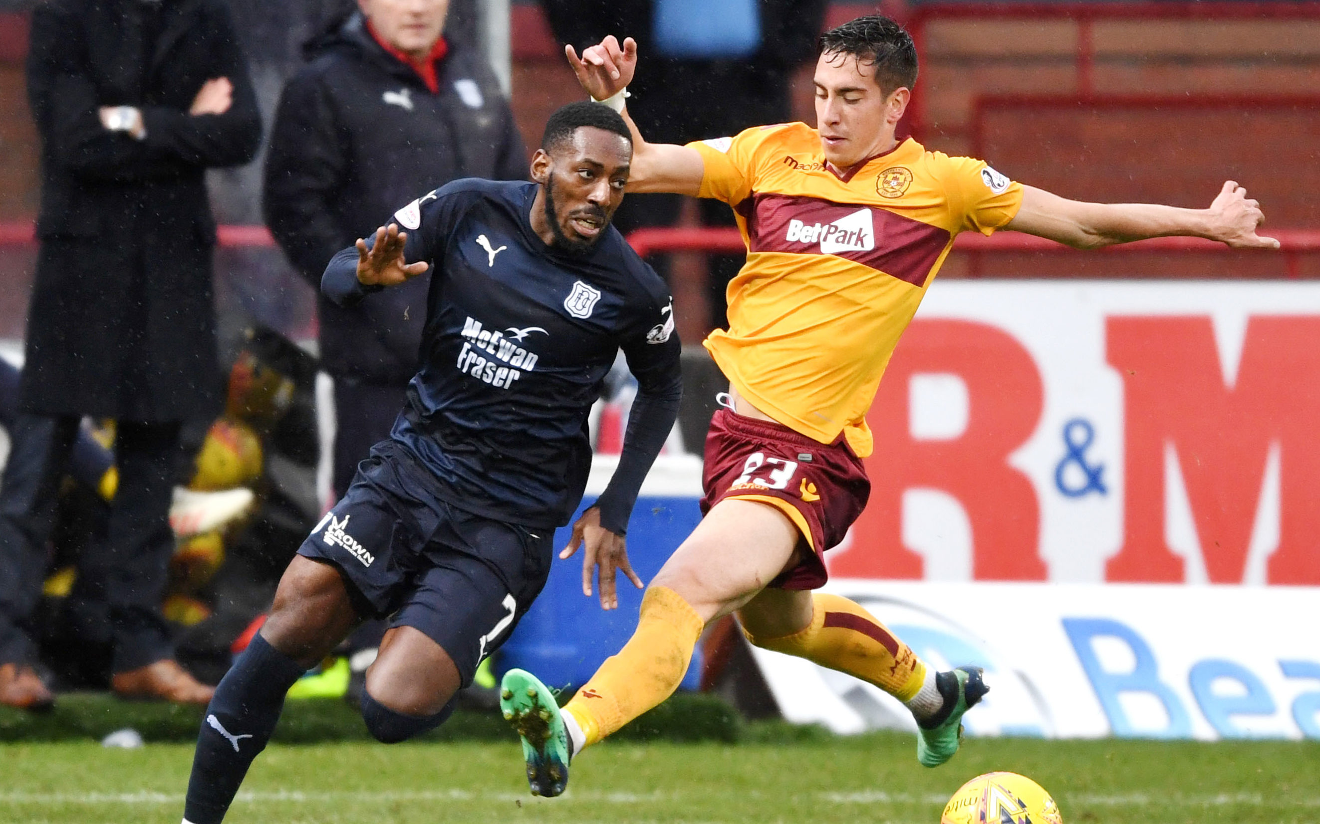 Dundee's Roarie Deacon battles with Motherwell's Alex Rodriguez-Gorrin.