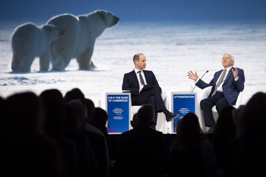 The broadcaster and natural historian, attend a session at the annual meeting of the World Economic Forum in Davos.
