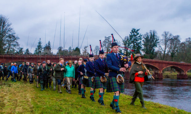 The parade before the opening led by Perth and District pipe band Pipe Major Alistair Duthie and Claire Mercer Nairne (of Meikleour Fishing). Meikleour Fishing, Kinclaven Bridge, by Meikleour.