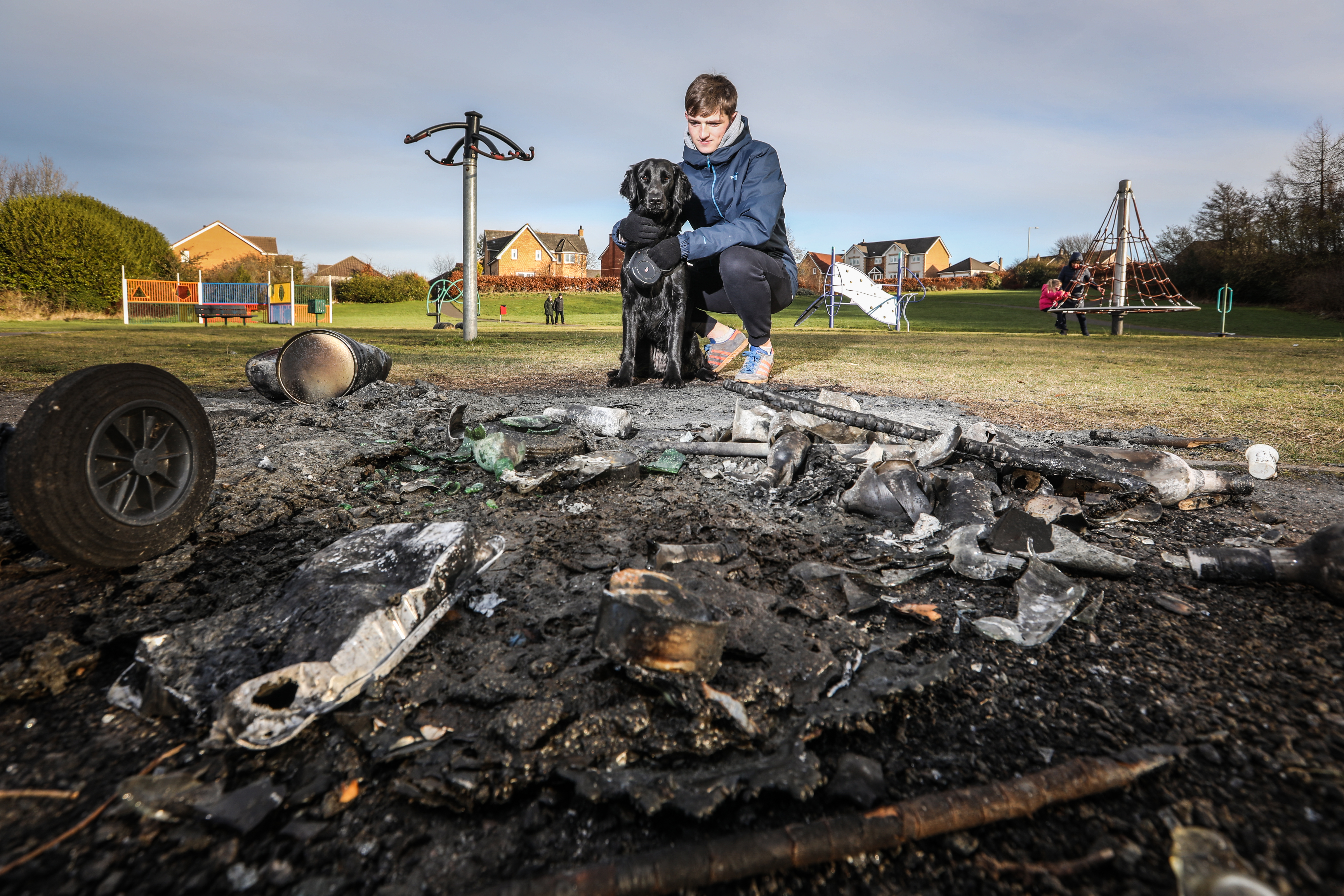 Fraser Burnett, 17 with his Lab Millie at the damaged area in Sandy Park.