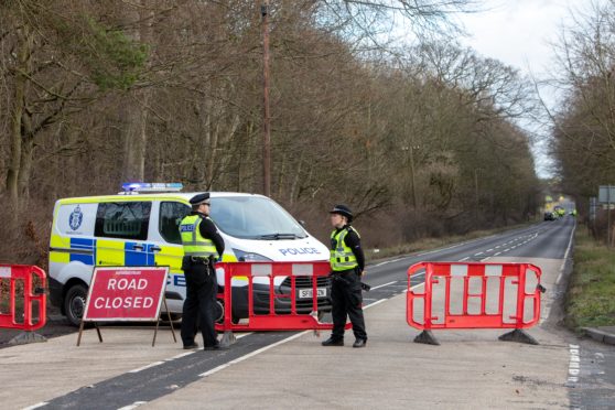 Police closed to the road to investigate a fatal accident on December 31