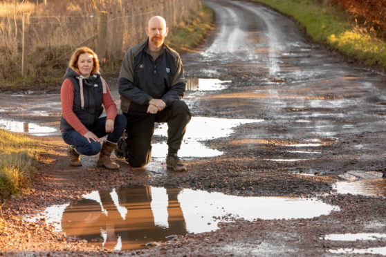 Laura Mysak and Alastair Stewart are looking for help from Fife Council to repair the potholed road they believe has been made worse by developments