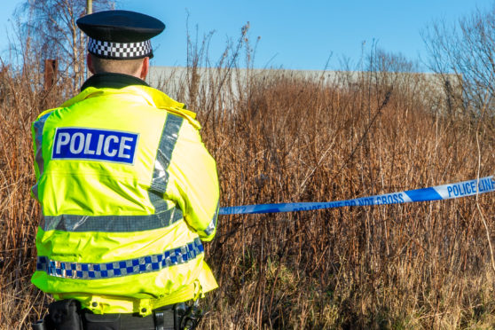 Police near the scene of the crime in Methil.