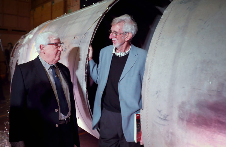 Former engineers Derek Mack and Mike Kelloway, both from the Isle of Wight, alongside the remains of the Black Arrow projectile.