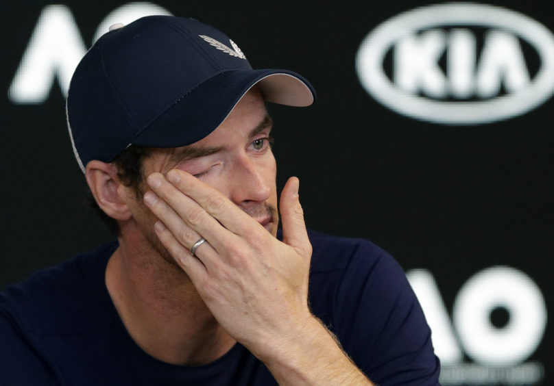 Britain's Andy Murray wipes tears from his face during a press conference where he announced the Australian Open could be his last tournament because of a hip injury that has hampered him for almost two years.
