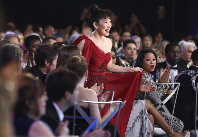 Sandra Oh wins the award for Outstanding Performance by a Female Actor in a Drama Series for Killing Eve.