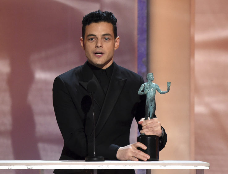 Rami Malek accepts the award for Outstanding Performance by a Male Actor in a Leading Role for Bohemian Rhapsody.