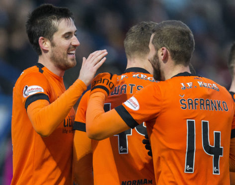 Dundee Unietd players celebrating one of their goals at Montrose.