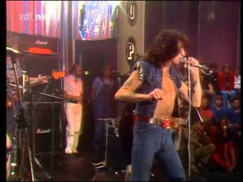 Bon Scott on stage with AC/DC in his glory days.