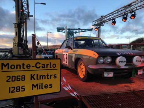 The 1972 Fiat of Angus driver John Roberts on the start ramp in the shadow of the Titan Crane