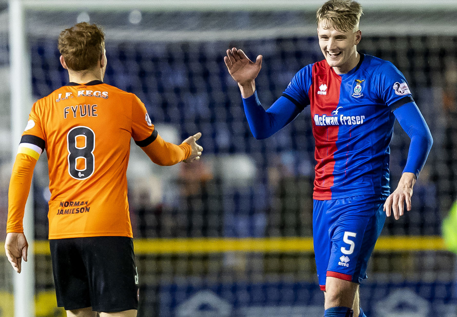 Inverness' Coll Donaldson with Dundee United captain Fraser Fyvie.