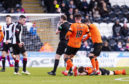 St Mirren's Paul McGinn (L) is booked by Willie Collum (centre) after clashing with Dundee United's Cammy Smith (on ground).