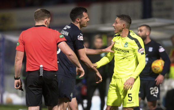 Dundee's Ryan McGowan exchanges words with Hibernian's Mark Milligan.