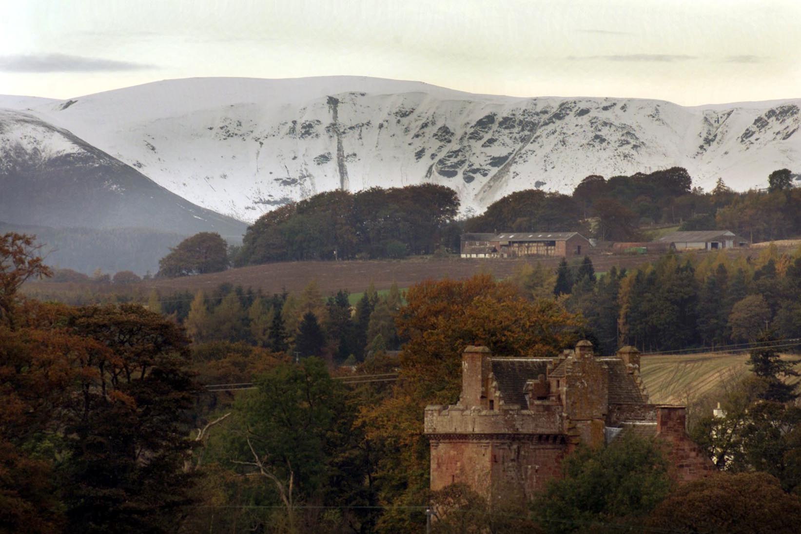 Looking North towards the snow covered Angus Glens, with Inverquharity Castle in the foreground.