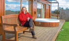 Caroline Milar relaxing at one of The Hideaway Experience luxury lodges she runs.