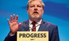 Angus Robertson addresses delegates at the Scottish National Party conference at the SEC Centre in Glasgow. PRESS ASSOCIATION Photo. Picture date: Tuesday October 10, 2017. See PA story POLITICS SNP. Photo credit should read: Jane Barlow/PA Wire