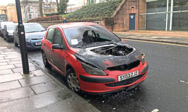The burned out car in Dundee had a parking ticket on it. However the council say it was not ticketed.