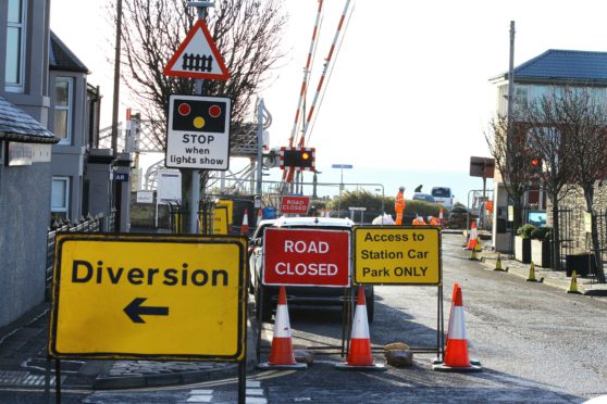 Work has begun on the Carnoustie level crossing which has closed Station Road.