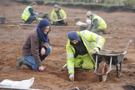 Claire Herbert (Archaeological Advisor to Angus Council) and Riccardo Caravello, one of the archaeological team at work, Balmachie Road, Carnoustie.