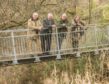 Ken Caldwell, second from left, at the River Leven.