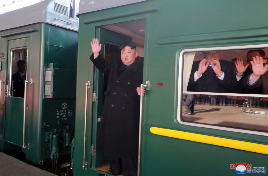 North Korean leader Kim Jong Un waves from a train before leaving Pyongyang Station, North Korea, for Vietnam. Kim was on a train Sunday to Vietnam for his second summit with U.S. President Donald Trump, state media confirmed. Independent journalists were not given access to cover the event depicted in this image distributed by the North Korean government.