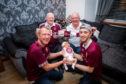 High five - Baby RJ, being held by dad Titch Jr (right), grandad Titch (left) and great grandad Ricky (back right) and great great grandad Dick (back left)
