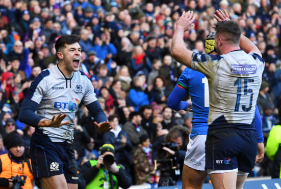 Blair Kinghorn(L) celebrates his opening try with team mate Stuart Hogg.