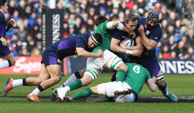 Scotland's Jonny Gray is tackled by Ireland's Jack Conan.