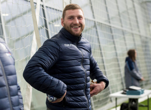 Finn Russell was all smiles at training on Monday, but yesterday was ruled out of the game in Paris.