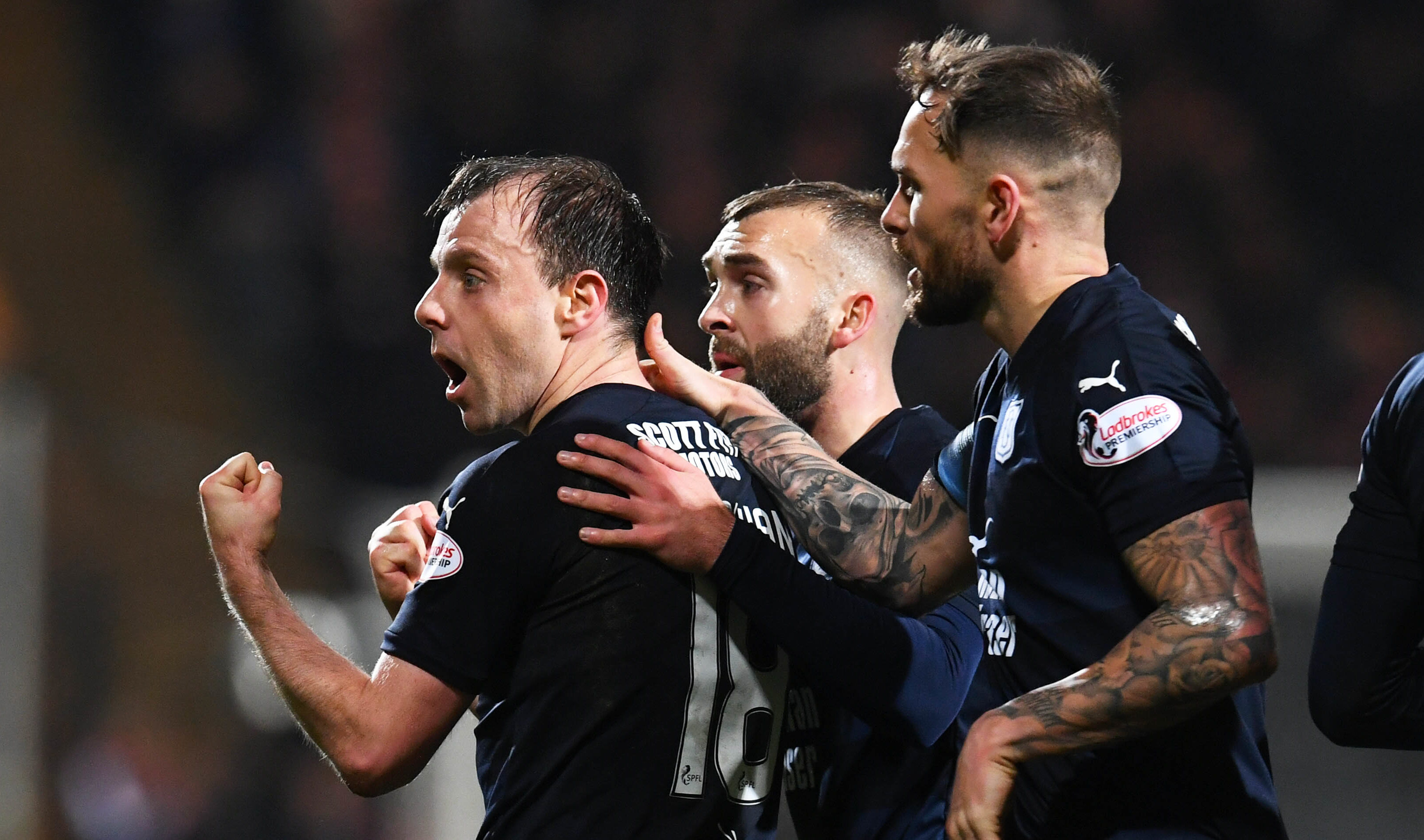 Paul McGowan, left, celebrates making it 1-1.