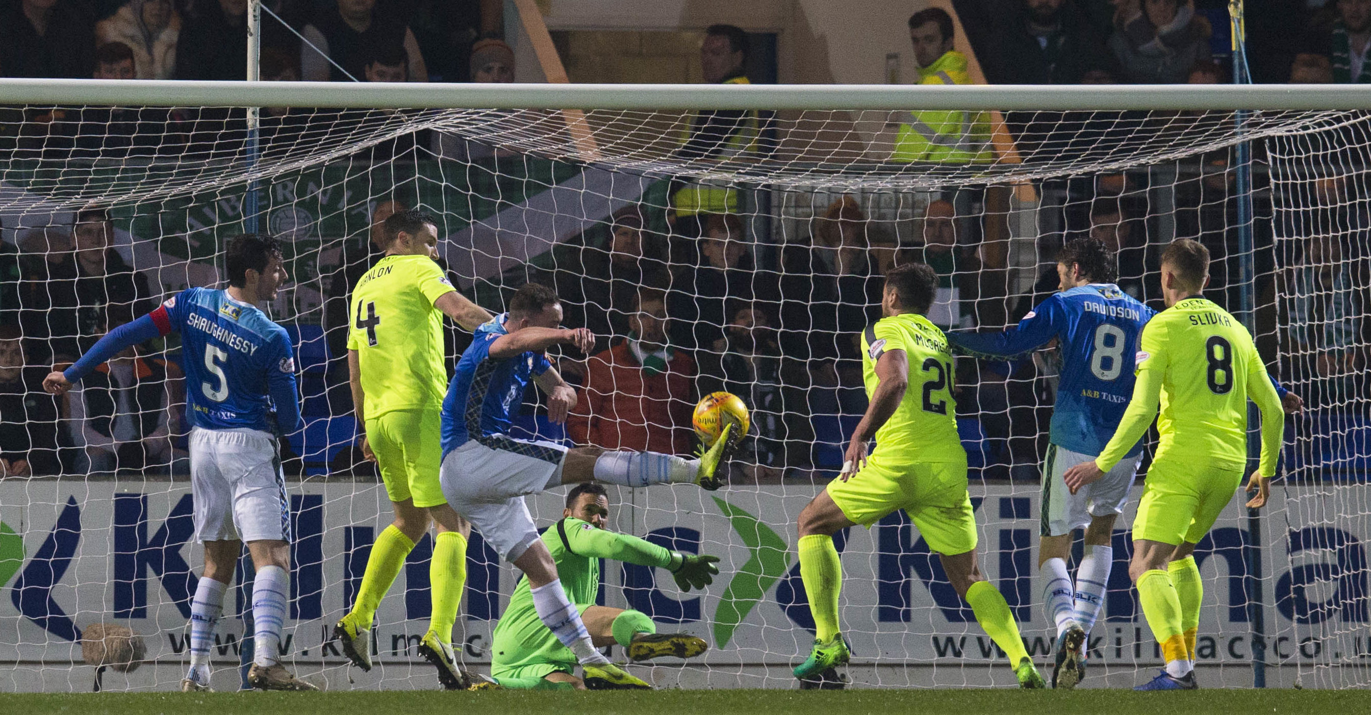 Chris Kane (centre) opens the scoring for Saints.