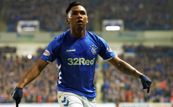 Alfredo Morelos celebrates making it 3-0 to Rangers.