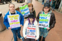 Kirstie Keatings (30), Lisha Keatings (27), Heather Bishop (32) and Damien Keatings (11) are all family and protesting about the refusal of cancer operation to former nurse Isabella Keatings.
