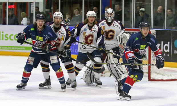 Stars Johan Andersson & Jordan Kelsall attack the Flames goal.