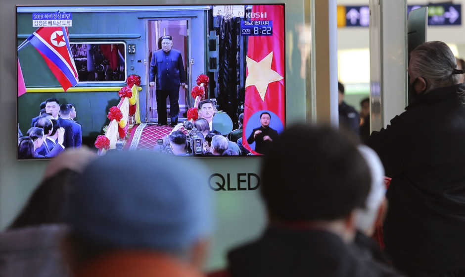 People watch a TV screen showing that North Korean leader Kim Jong Un arrives in Dong Dang, Vietnamese border town, at Seoul Railway Station in Seoul, South Korea.