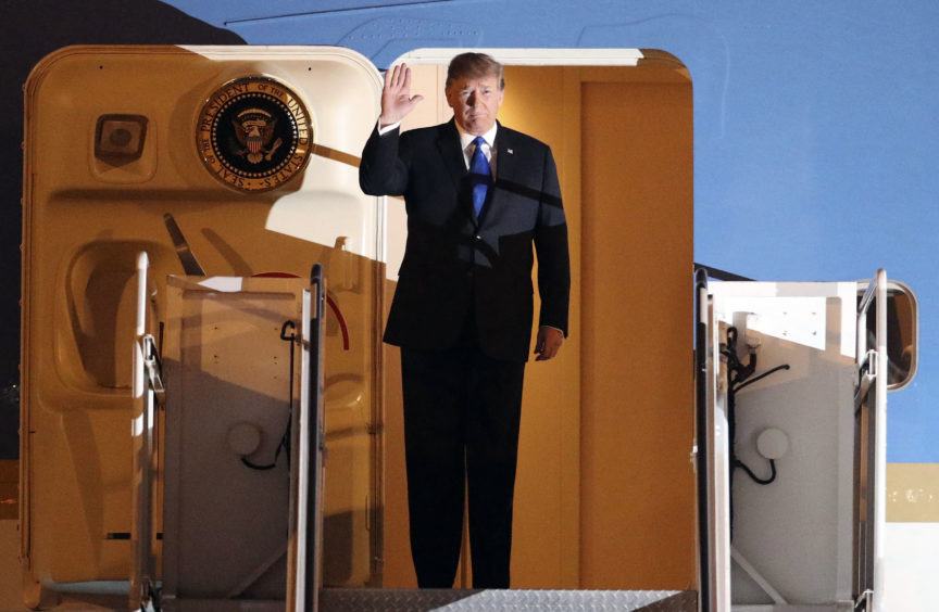 U.S President Donald Trump arrives at Noi Bai Airport before a summit with North Korean leader Kim Jong Un,