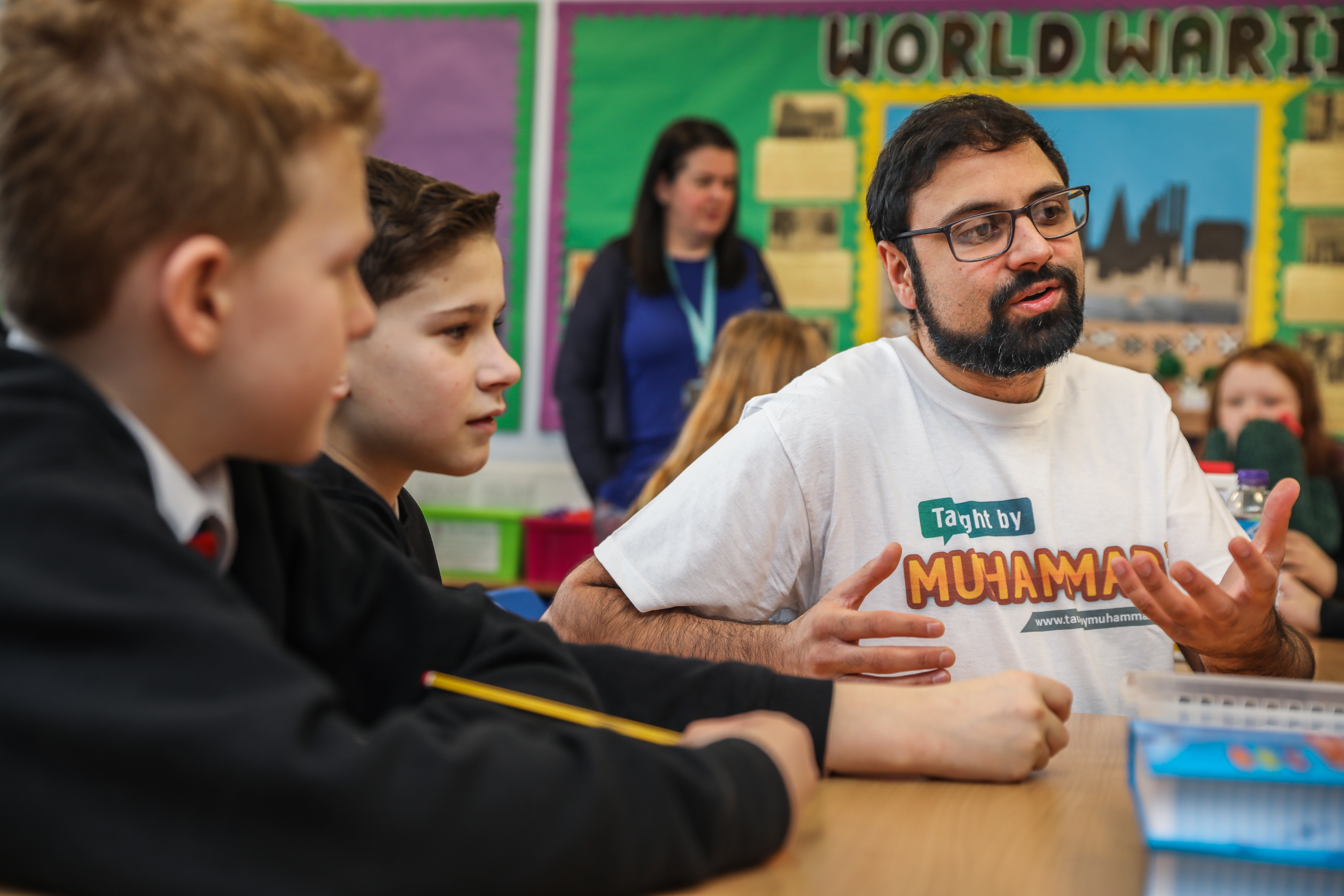 Project Manager Rizwan Rafik speaks to kids at a Dundee primary school.