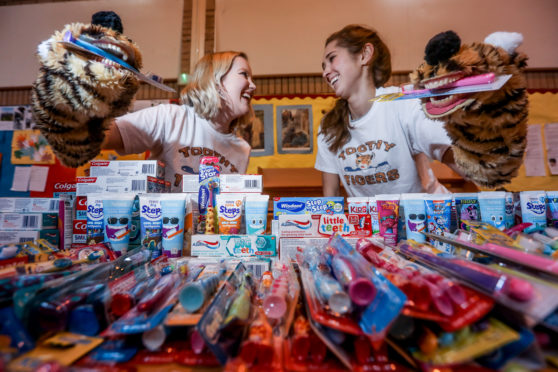 Dental students Jill McMurray and Megan Donaldson with their mascots 'toothy tigers' at Meadowside St Paul’s Church