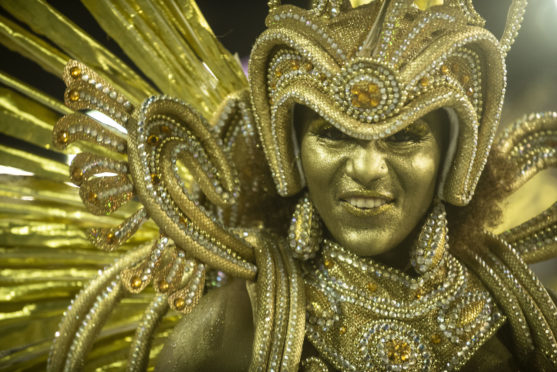 A performer dances during Viradouro performance at the Rio de Janeiro Carnival at Sambodromo in Rio de Janeiro, Brazil.