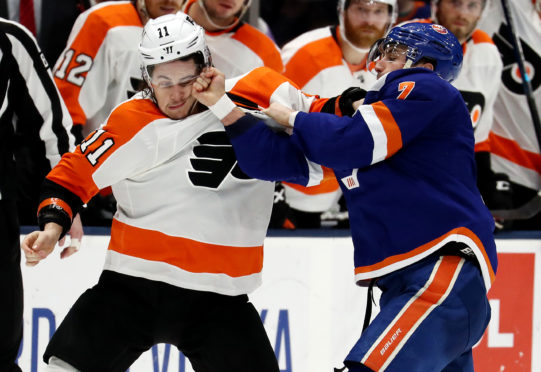 Travis Konecny #11 of the Philadelphia Flyers fights with Jordan Eberle #7 of the New York Islanders during their game at NYCB Live's Nassau Coliseum on March 03, 2019 in Uniondale, New York.