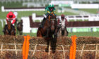 Espoir D'Allen ridden by Mark Walsh clears the final fence during the Unibet Champion Hurdle Challenge Trophy. Michael Steele/Getty Images