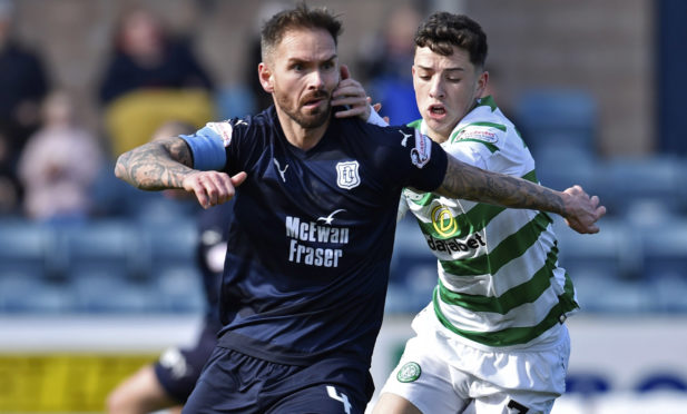 Martin Woods (L) in action for Dundee with Celtic's Michael Johnston.